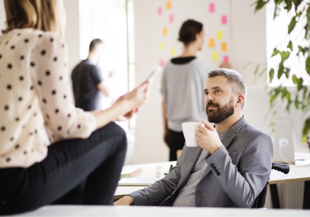 demo-attachment-470-business-people-with-wheelchair-in-the-office-P9M4RX3